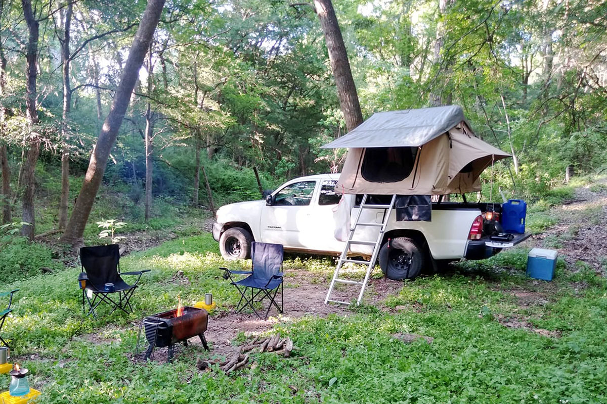 Smittybilt Overlander rooftop tent in forest